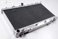 Hlinikový závodní chladič Japspeed Subaru Impreza WRX/STI (03-07) 30mm